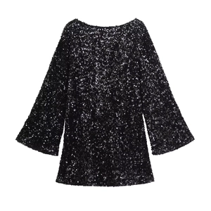 Detailed close-up of a black sequin long sleeve dress with a crew neck and shiny texture