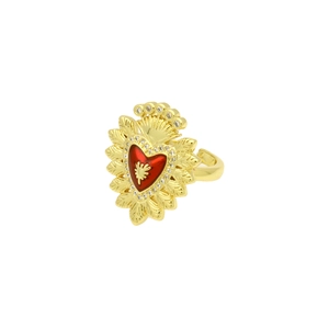 Macro view of gold ring with red enamel sacred heart and sparkling crystals