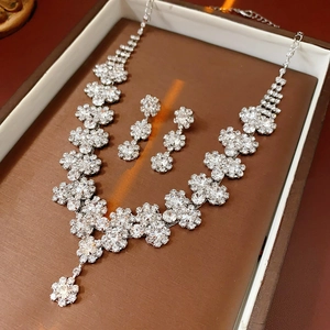 Exquisite silver sunflower jewelry set with sparkling crystals in a premium brown display box