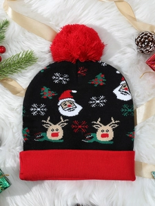 Detailed knit pattern showing Santa, reindeer, and snowflakes on a Christmas beanie