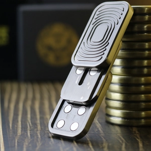 Macro detail of silver EDC slider toy with metallic wavy texture and magnetic mechanism