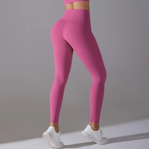 Rear view of high-waisted hot pink yoga leggings with seamless butt-lifting design
