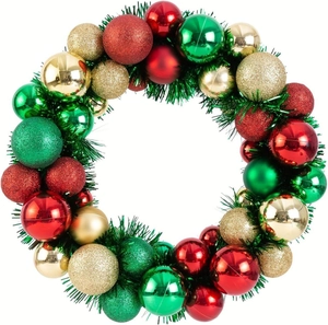 Christmas wreath with red, green and gold ornaments on tinsel base, white background