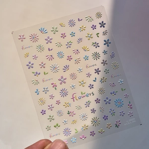Macro view of 3D embossed colorful floral nail art stickers with relief texture