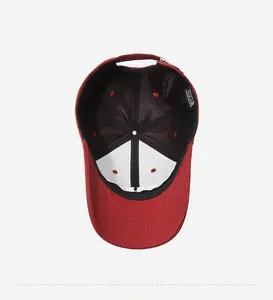 Detailed interior of red cotton baseball cap with mesh lining and quality stitching