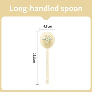 Detailed view of cream ceramic long handle spoon with bear pattern and 16.8cm size mark