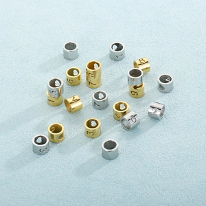 Gold and silver stainless steel roman numeral beads with heart cutouts for DIY jewelry