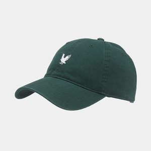 Close-up of eagle embroidery on dark green cotton baseball cap with curved brim details