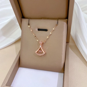 Rose gold dancing skirt necklace with pink crystal and sparkling diamond inlay in a gift box