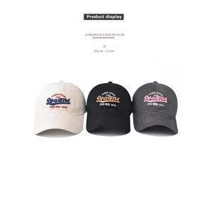 Detailed view of three baseball caps showing 3D embroidery and breathable cotton fabric