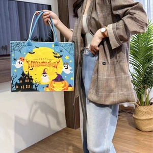 Blue Halloween felt tote bag with pumpkin ghost pattern and Happy Halloween text