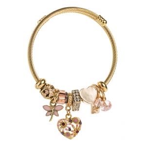 Detail of gold steel wire bracelet with pink dragonfly and heart pendants