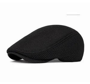 Detail of black mesh fabric on a breathable flat cap with lightweight honeycomb texture