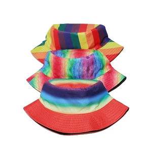 Detailed stack of vibrant rainbow striped, tie-dye, and color-block cotton bucket hats