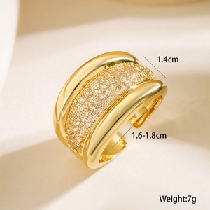 Detail showing 1.4cm wide triple band gold ring with zircon pavé and open size design