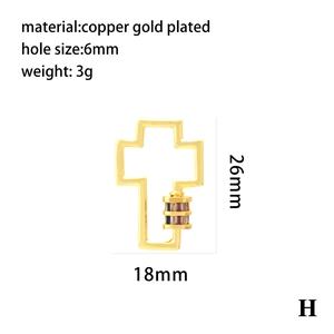 Macro detail of a 18x26mm gold plated cross pendant with colorful zircon and spring clasp