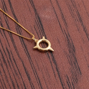 Gold necklace featuring a unique three-spike ring pendant on a fine box chain