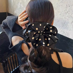 Elegant black and white polka dot fabric oversized scrunchie for low ponytail styling