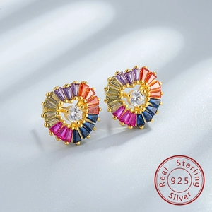 Macro detail of 925 sterling silver rainbow heart earrings with colorful crystal stones