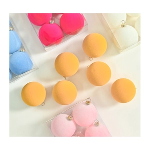 Close-up of 6cm macaron colored flocked Christmas ornaments with metal hanging loops