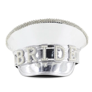 Detailed view of silver party hat with BRIDE pearl lettering and rhinestone trim