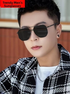 Close-up of stylish men's pilot sunglasses with black metal double bridge and gray lenses