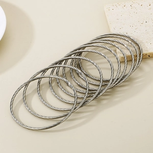 Minimalist stackable twisted rope bangles made of durable silver titanium steel