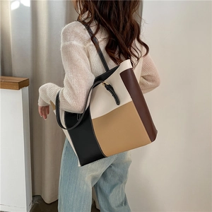 Minimalistische Color-Block-Einkaufstasche in Schwarz und Beige mit Schulterriemen