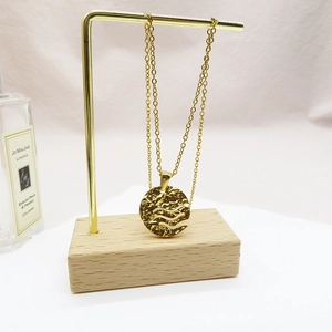 Chic 18K gold-plated titanium steel necklace with hammered circular hollow wave pendant