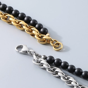 Detailed macro shot of vintage black onyx bead bracelet with stainless steel lobster clasp