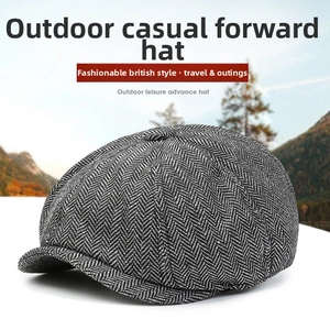 Detailed close-up of the black and white herringbone fabric texture on a flat cap