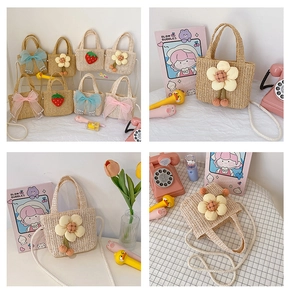 Detail showing kids straw bags with cute sunflower decorations and pearl chain straps