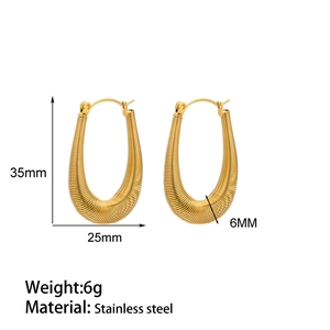 Detailed view of 35mm gold-plated stainless steel hoop earrings with spiral texture design