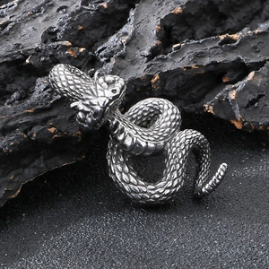 Dark punk style stainless steel python snake pendant with detailed scales on black charcoal