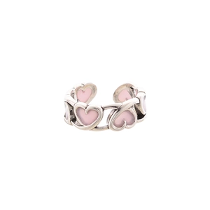 Elegant silver open ring featuring pink enamel hollow hearts in a chic, adjustable design