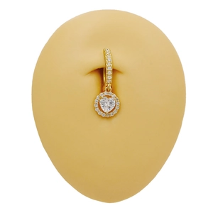 Detailed view of a golden heart belly ring with white cubic zirconia on silicone skin