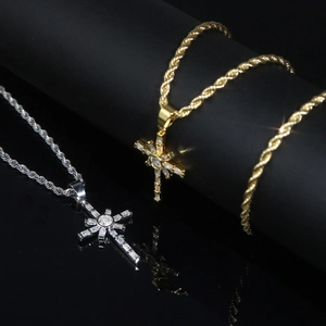 Close-up of gold and silver hip hop necklaces with sparkling zircon cross pendants