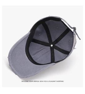 Detailed interior of vintage distressed baseball cap with metal buckle and sweatband