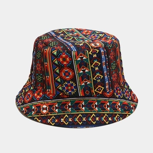 Detailed view of reversible sun bucket hat with colorful tribal geometric patterns