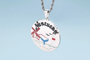 Detail of silver titanium pendant with Nantucket nautical pattern and twisted rope chain
