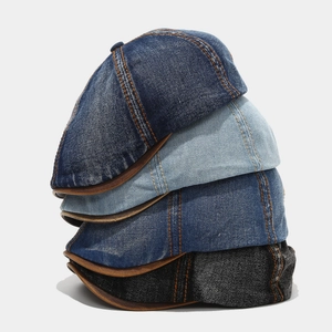 Vintage washed denim beret hats set in four colors with contrast stitching and leather trim