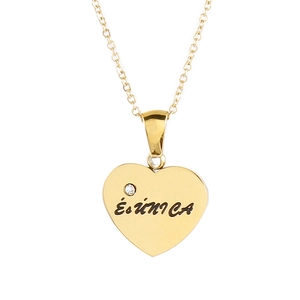 Golden heart pendant necklace with crystal and 'És única' engraving on white background