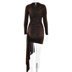 Detail view of smooth silk texture on dark brown slim fit mini dress with side ruching