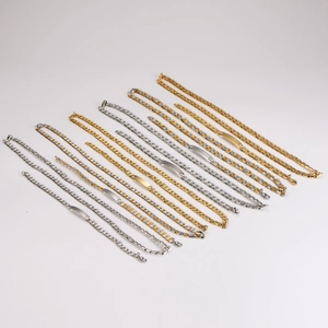 Golden and silver stainless steel 7mm Cuban link chains with blank ID tags on white base