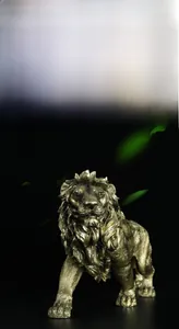 Detail showing the intricate fur texture and gold resin finish of the lion statue