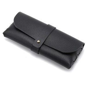 Minimalist black pebble grain leather sunglasses pouch with gold metallic snap button