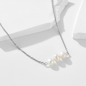Elegant 925 sterling silver necklace with three natural freshwater pearls on white stones