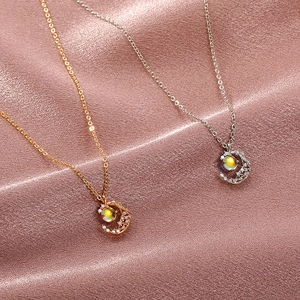 Minimalist moonstone crescent moon pendant necklace in gold and silver finishes