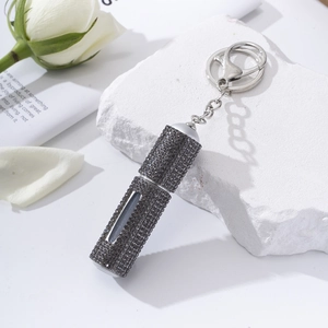 Sparkling dark grey rhinestone refillable perfume bottle keychain on stone base