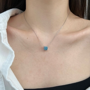 Elegant S925 sterling silver necklace featuring a square-cut blue zircon pendant on a model